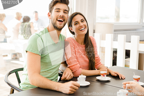 Image of Young couple drinking coffee