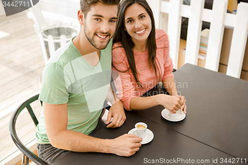 Image of Young couple drinking coffee