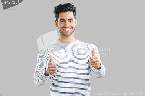 Image of Handsome man with thumbs up