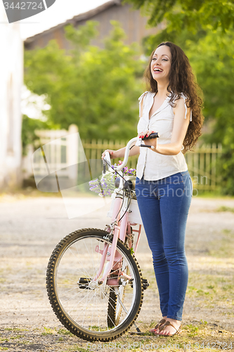 Image of Girl with her bicycle