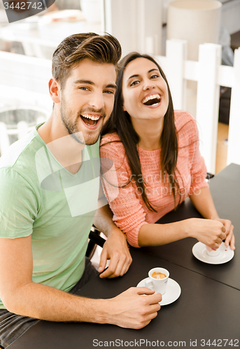 Image of Young couple drinking coffee