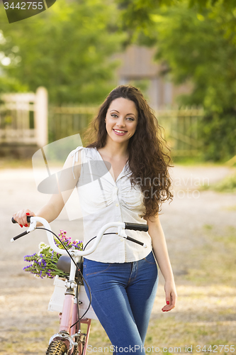 Image of Girl with her bicycle