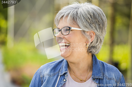 Image of Mature woman laughing