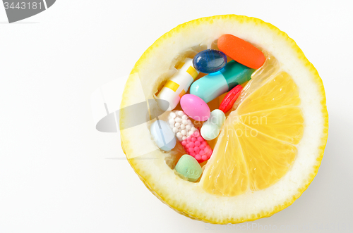 Image of pills and lemon  isolated 
