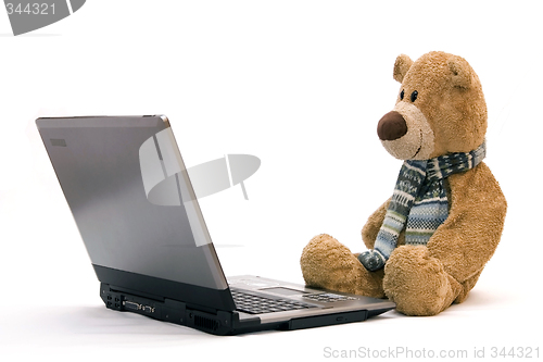 Image of Laptop and teddy bear