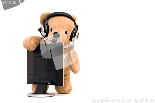 Image of Laptop and teddy bear
