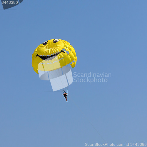 Image of Parasailing in a blue sky