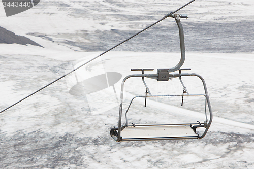 Image of Empty ski lift above snow