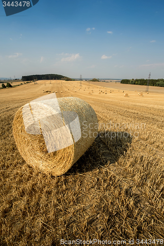 Image of Beautiful landscape with straw bales in harvested fields