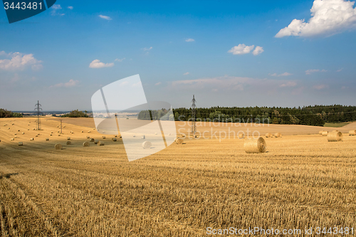 Image of Beautiful landscape with straw bales in harvested fields