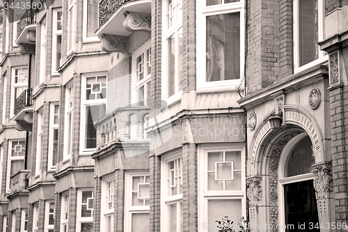 Image of old window in europe london  red brick wall and      historical 