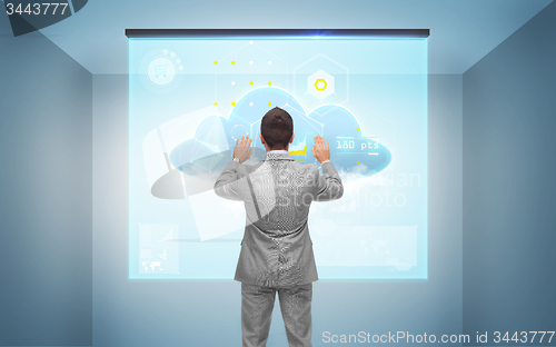 Image of businessman working with virtual screen