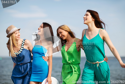 Image of girls walking on the beach