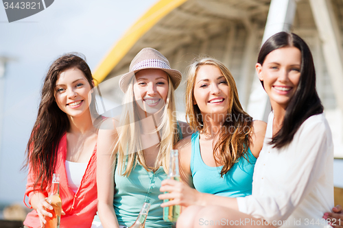 Image of girls with drinks on the beach