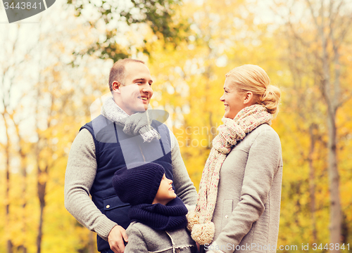 Image of happy family in autumn park