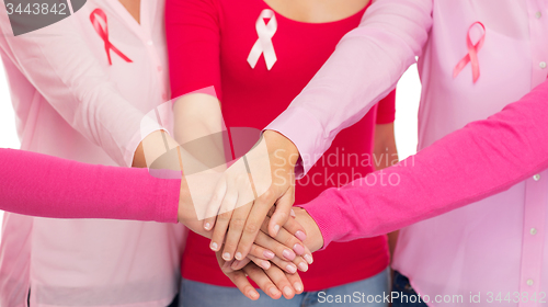 Image of close up of women with cancer awareness ribbons