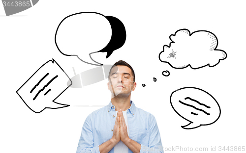 Image of man praying to god with text bubble doodles