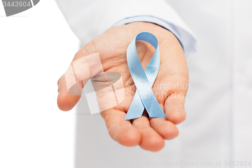 Image of doctor hand with prostate cancer awareness ribbon