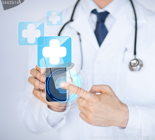 Image of doctor holding smartphone with medical app