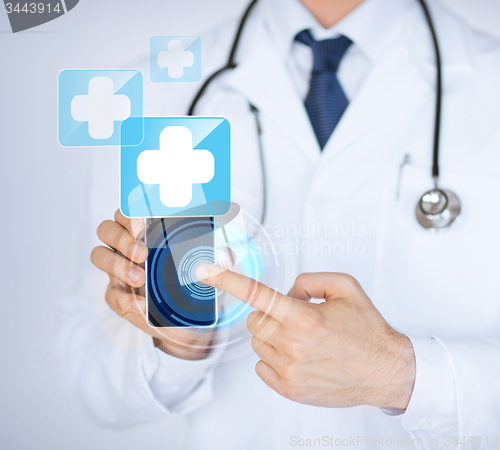Image of doctor holding smartphone with medical app