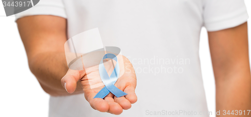 Image of hand with blue prostate cancer awareness ribbon