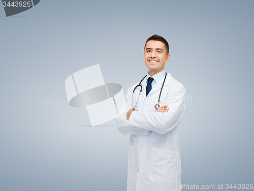 Image of smiling male doctor in white coat