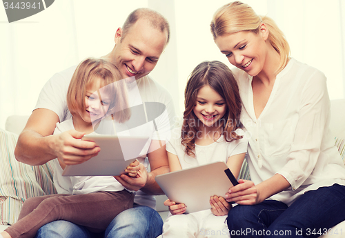 Image of family and two kids with tablet pc computers