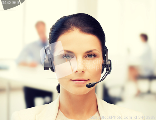 Image of female helpline operator with headphones