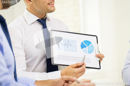 Image of close up of businessman hands with clipboard