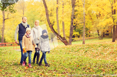 Image of happy family in autumn park