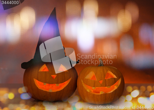 Image of close up of carved halloween pumpkins on table