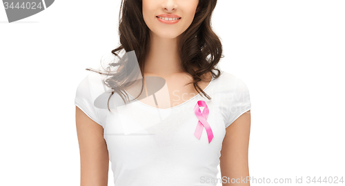 Image of smiling woman with pink cancer awareness ribbon