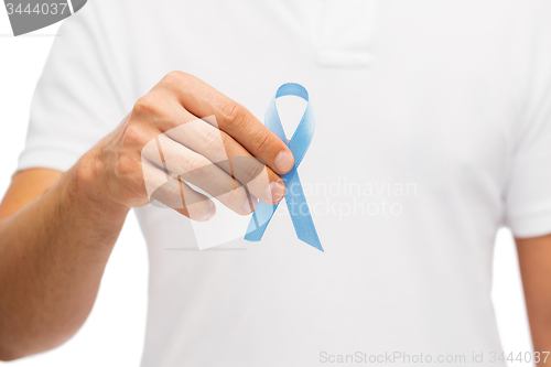 Image of hand with blue prostate cancer awareness ribbon