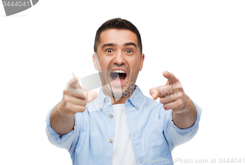 Image of scared man shouting and pointing finger on you