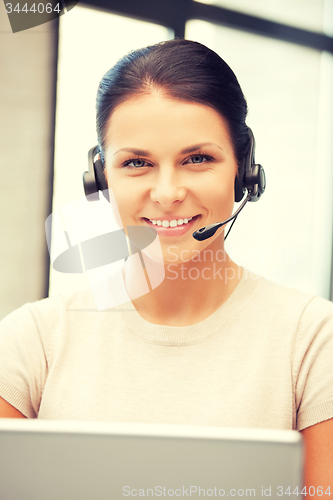 Image of helpline operator with laptop computer