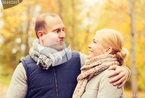 Image of smiling couple in autumn park