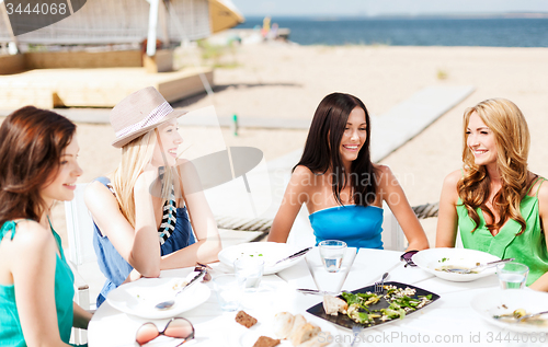 Image of girls in cafe on the beach