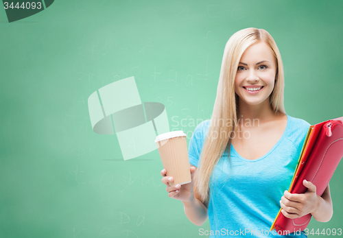 Image of smiling student girl with folders and coffee cup