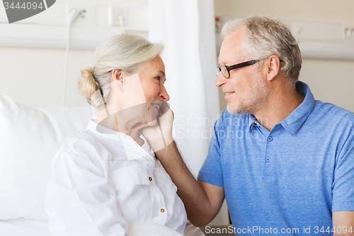 Image of senior couple meeting at hospital ward