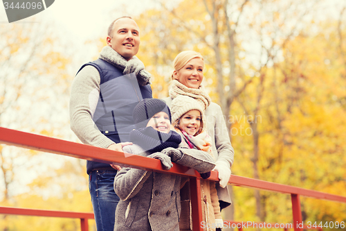 Image of happy family in autumn park