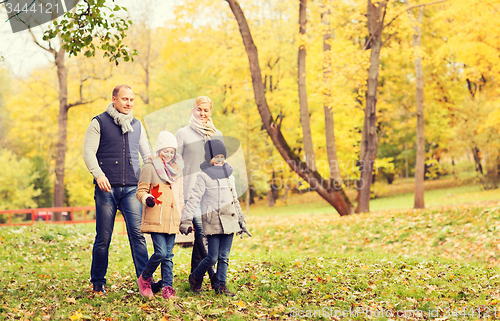 Image of happy family in autumn park