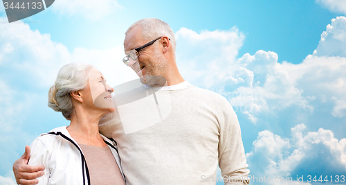 Image of happy senior couple over blue sky and clouds