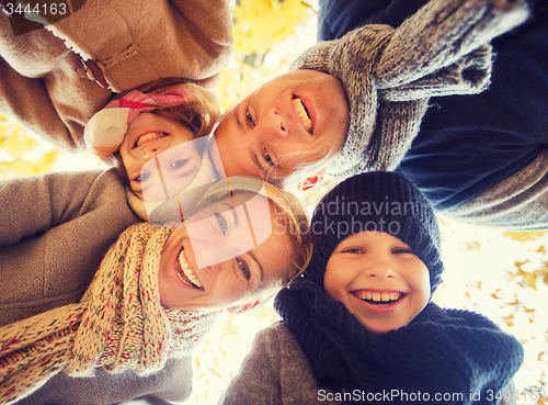 Image of happy family in autumn park