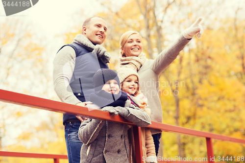 Image of happy family in autumn park