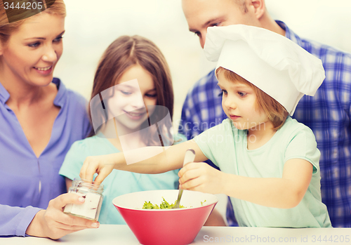 Image of happy family with two kids eating at home