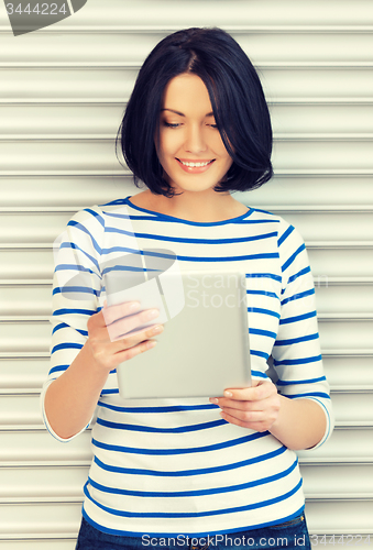 Image of happy teenage girl with tablet pc computer