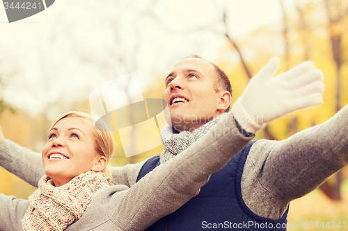 Image of smiling couple in autumn park