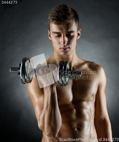 Image of young man with dumbbell