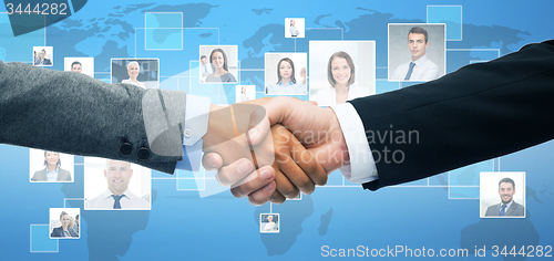 Image of businessman and businesswoman shaking hands