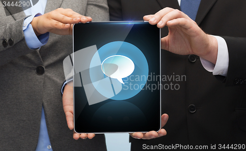 Image of businessman and businesswoman with tablet pc